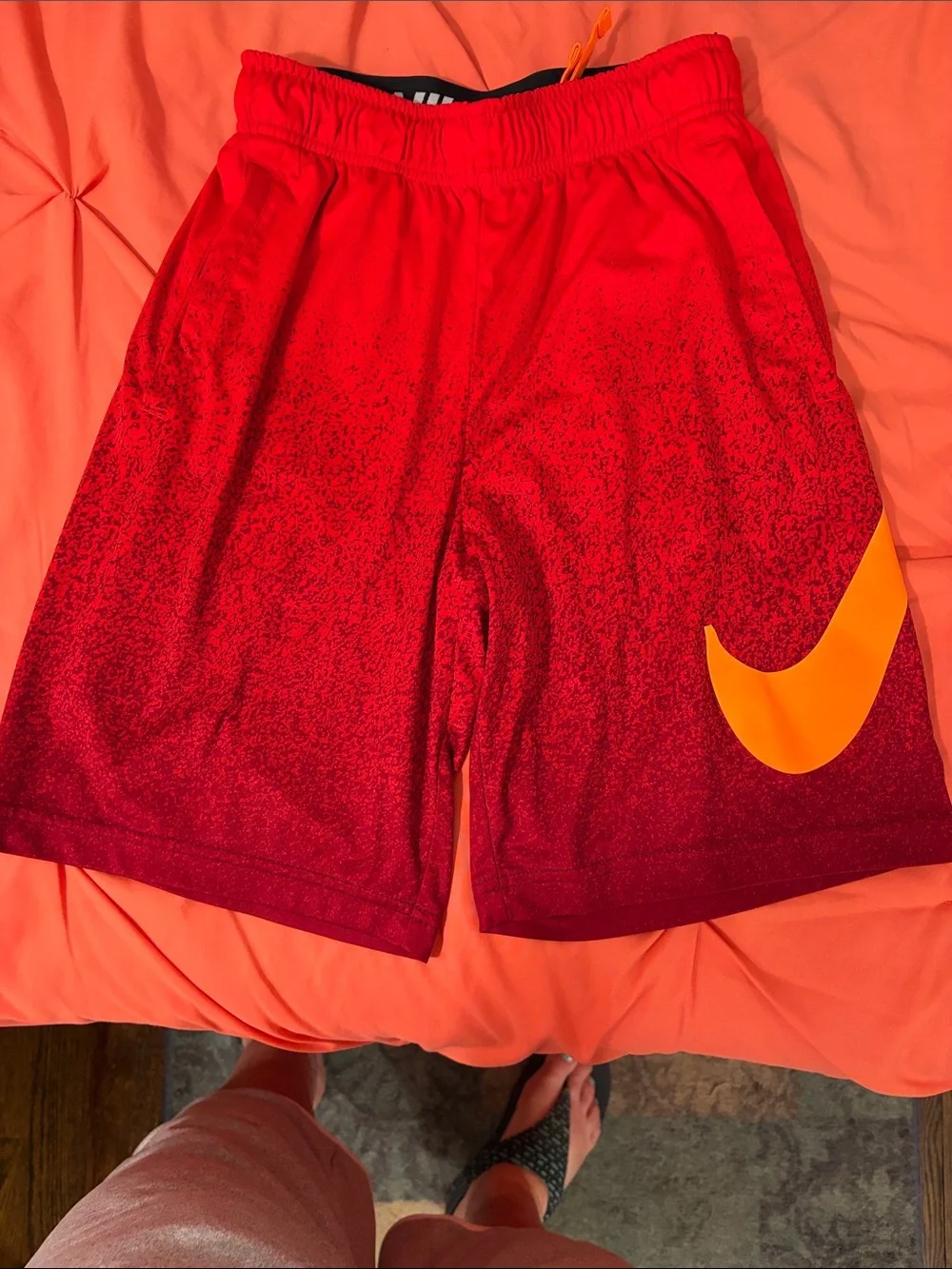 Nike Red Athletic Shorts with Orange Swoosh
